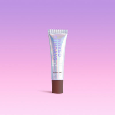 Midnight Kiss sheer brown nude SPF50 lip treatment tube in 15mL size against a purple and pink gradient background.