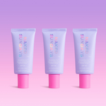 Three tubes of Naked Sundays BeautyBarrier on a pink and purple gradient background