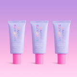 Three tubes of Naked Sundays BeautyBarrier on a pink and purple gradient background