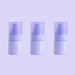 Three mini sized Naked Sundays Hydrating Glow Mists SPF50 sitting against a purple background