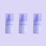 Three mini sized Naked Sundays Hydrating Glow Mists SPF50 sitting against a purple background
