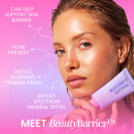 Woman holding a tube of BeautyBarrier sunscreen with product features listed on a pink and purple gradient background.