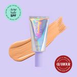 Naked Sundays Beauty sunscreen tube with a swatch on a purple background, featuring 'Acne Safe SPF' and 'Glamour Beauty & Wellness Awards 2026 Winner' badges