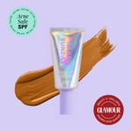 Naked Sundays Beauty sunscreen tube with a swatch on a purple background, featuring 'Acne Safe SPF' and 'Glamour Beauty & Wellness Awards 2026 Winner' badges.