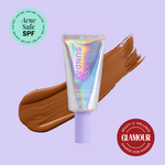 Naked Sundays Beauty sunscreen tube with a swatch on a purple background, featuring 'Acne Safe SPF' and 'Glamour Beauty & Wellness Awards 2026 Winner' badges