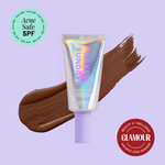Naked Sundays Beauty sunscreen tube with a swatch on a purple background, featuring 'Acne Safe SPF' and 'Glamour Beauty & Wellness Awards 2026 Winner' badges