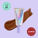 Naked Sundays Beauty sunscreen tube with a swatch on a purple background, featuring 'Acne Safe SPF' and 'Glamour Beauty & Wellness Awards 2026 Winner' badges