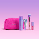 Naked Sundays pink makeup bag with SPF products on a pink background.