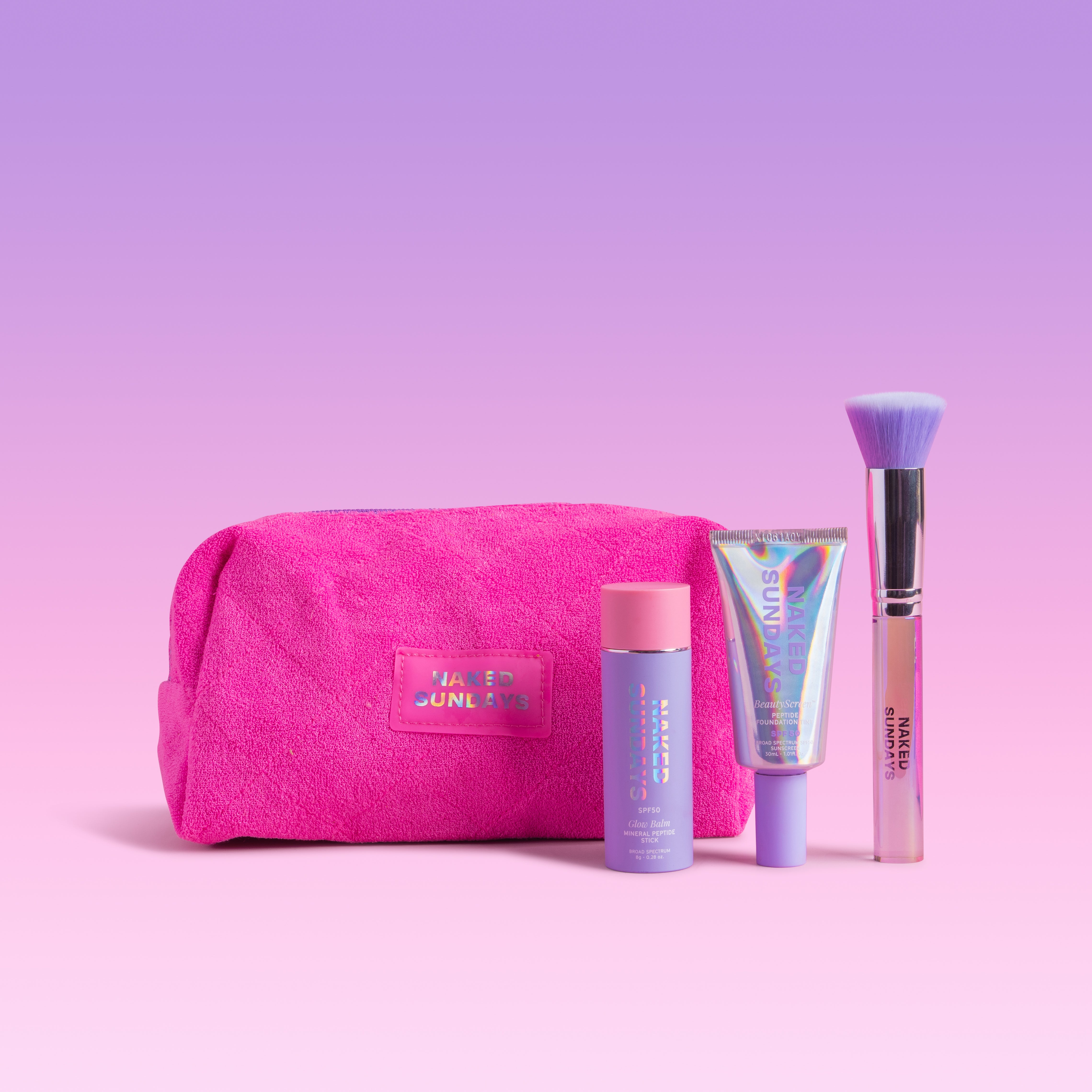Pink Naked Sundays bag with SPF Beauty items on a pink background