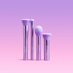 Four purple Naked Sundays make up and sunscreen Brushes.