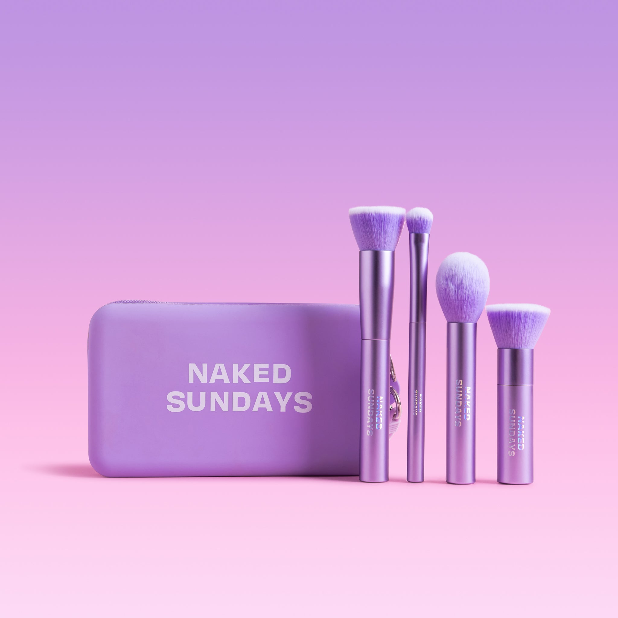 Naked Sundays Four Set of Brushes with purple carry purse.