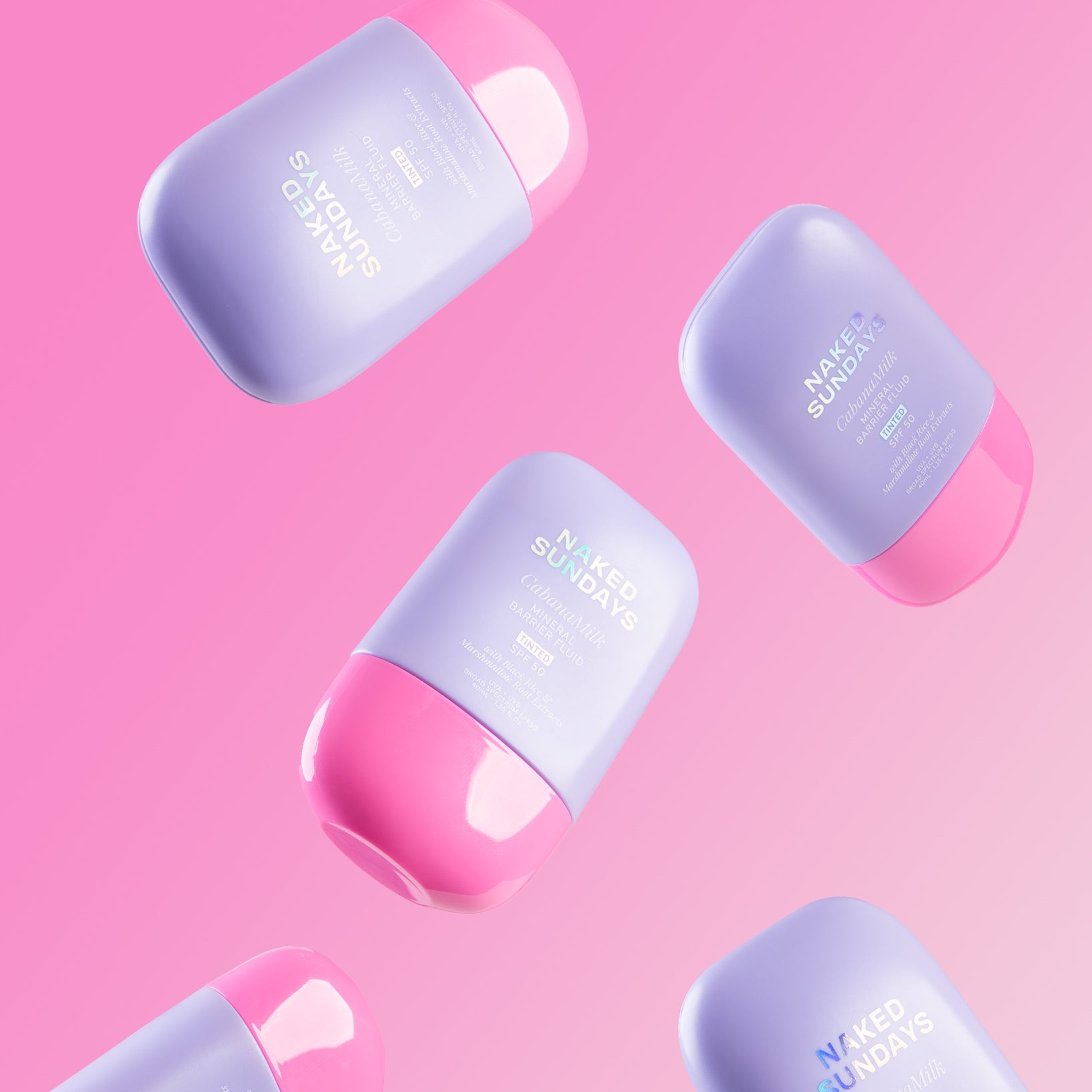 Naked Sundays SPF bottles on a pink background