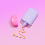 Naked Sundays CabanaMilk Mineral Barrier Fluid SPF50 on a purple background