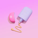 Naked Sundays CabanaMilk Mineral Barrier Fluid SPF50 on a purple background