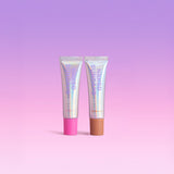 Two tubes of Naked Sundays PoutScreen Lip Treatments sunscreen on a gradient purple and pink background
