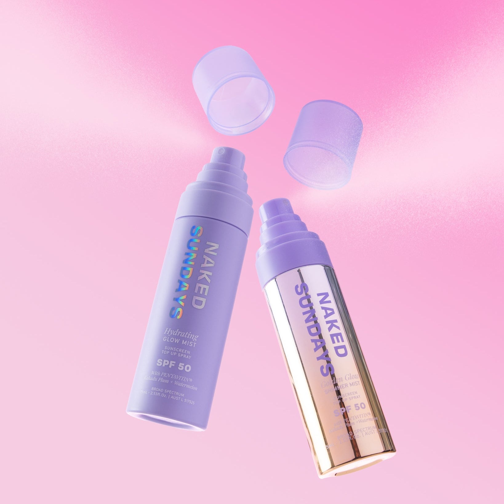 Two Naked Sundays SPF 50 glow mist spray bottles in matte lilac and metallic gold floating against a pink background
