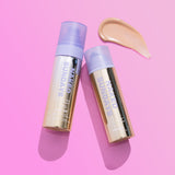 Two 'Naked Sundays' skincare products on a pink background with a swatch of beige color