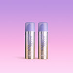 Two bottles of Naked Sundays CabanaClear Illuminating Water Gel Serum SPF50 against a pink and purple gradient background