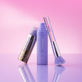 Naked Sundays SPF50 Glow Mist + CabanaClear Illuminating + SPF Brush Bundle on a pink + purple gradient background