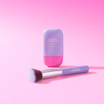 Makeup product and brush with 'Naked Sundays' branding on a pink background