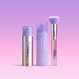 Three Naked Sundays SPF products on a pink + purple gradient background