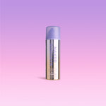 A bottle of Naked Sundays CabanaClear™ Water Gel Serum SPF50 in Illuminating against a pink background.