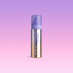 SPF50 Shimmer Mist bottle labeled 'Naked Sundays' on a gradient purple background