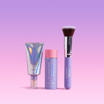 Naked Sundays products including a t BeautyScreen SPF50 tube, Glow Balm SPF50 and SPF BFF brush on a pink background