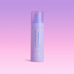 Naked Sundays Glow Mist SPF50 bottle on a gradient purple background