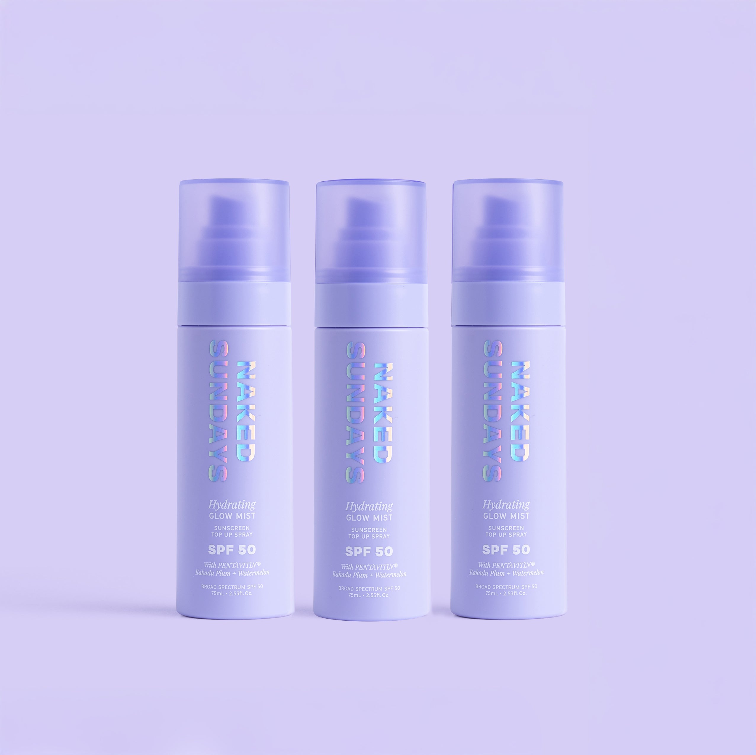 Three bottles of Naked Sundays Mist with a purple background