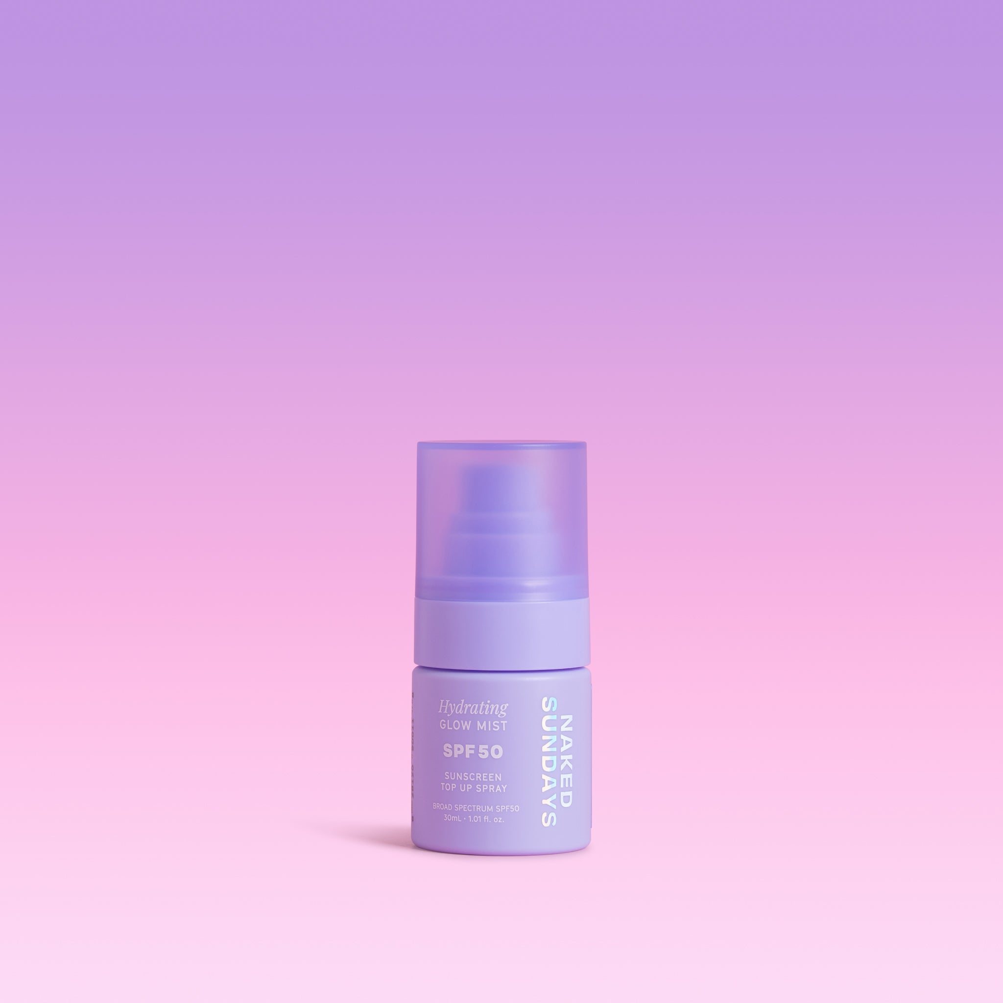 Naked Sundays Mini Glow Mist bottle on a gradient purple background