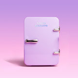 Small purple refrigerator with 'Naked Sundays' branding on a gradient pink and purple background