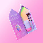 CabanaMilk SPF50 set in a house shaped box with a mineral fluid bottle, makeup brush, and sticker sheet on pink